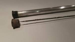 Old Sacrificial Anode and Replacement Sacrificial Anode - replaced during hot water unit service
