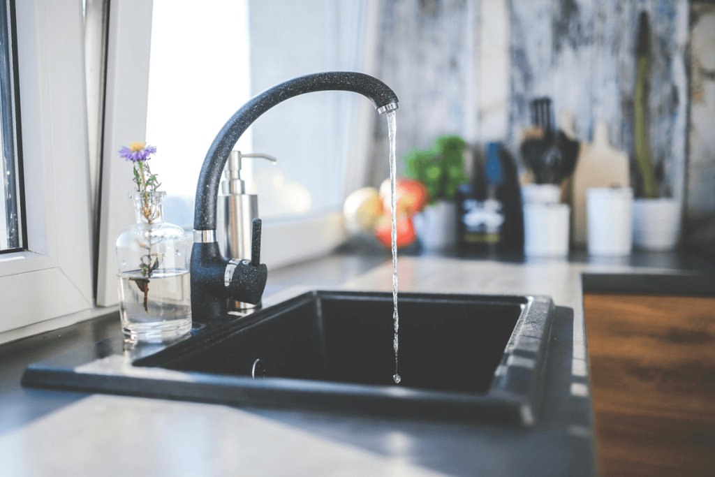 Running kitchen tap into sink.  Running your taps to clear stagnant water and fill p-traps is a plumber's hot tip post holidays.