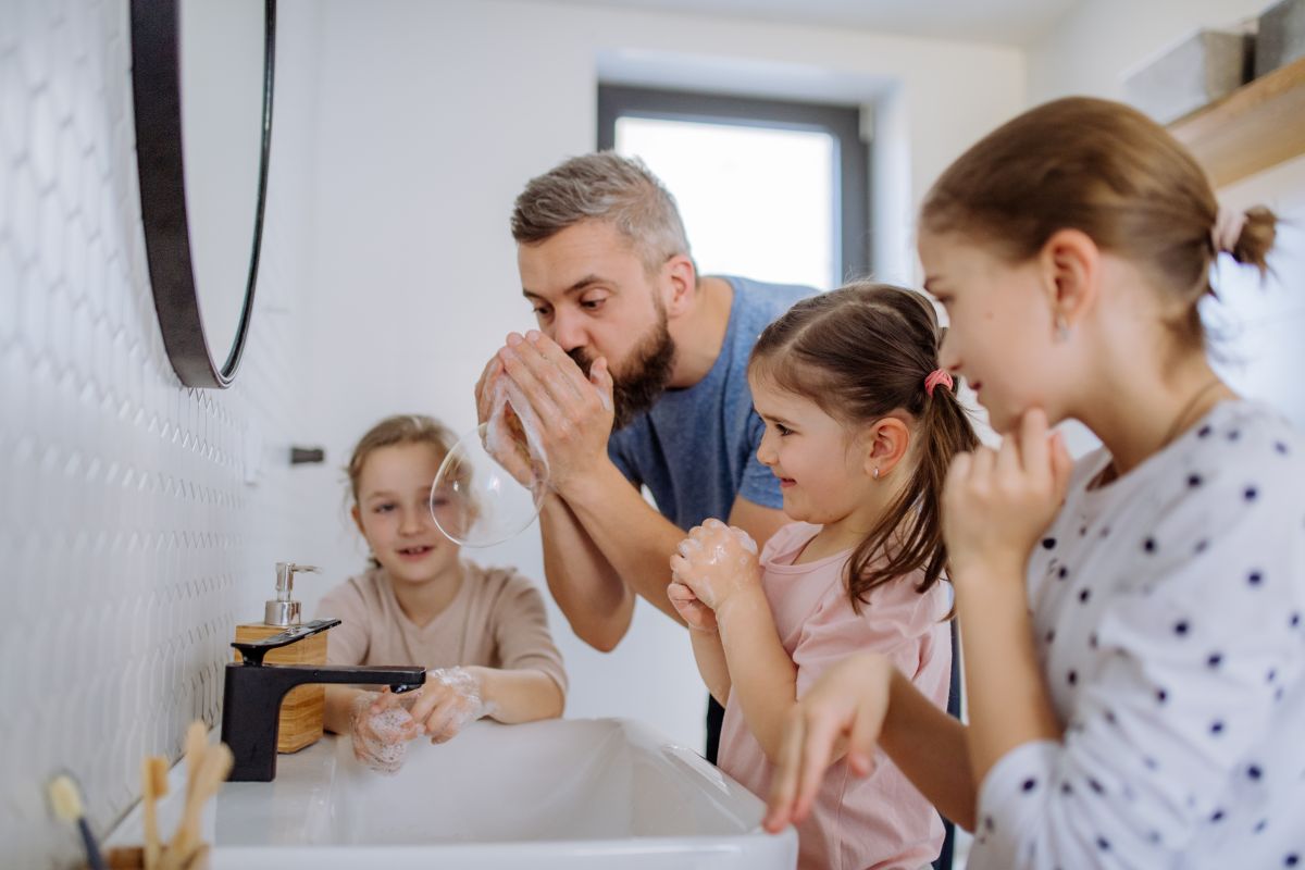 Large family bathroom full of kids - heat pumps are the best hot water system for big families