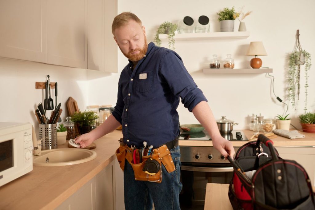 The best plumbers in brisbane on the job fixing kitchen sink