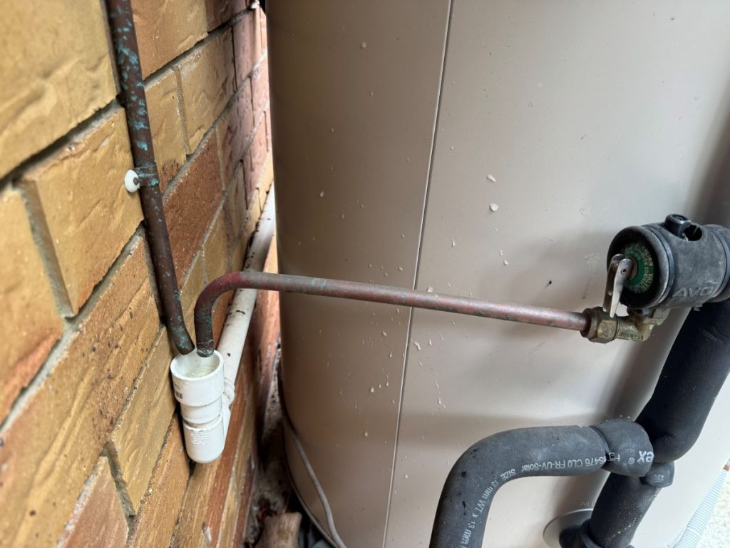 Water outlets directed into drain from hot water valves